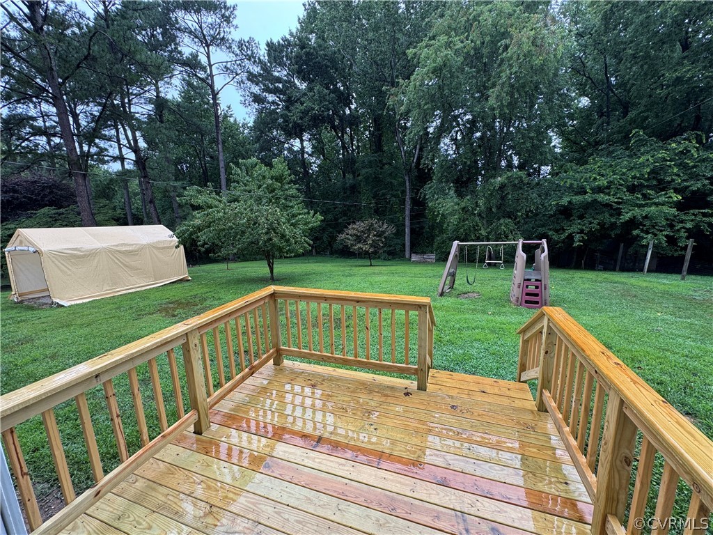 10110 Oldham Road Richmond, VA 23235 - Photo 6 of 26 a view of a deck with two chairs and a table