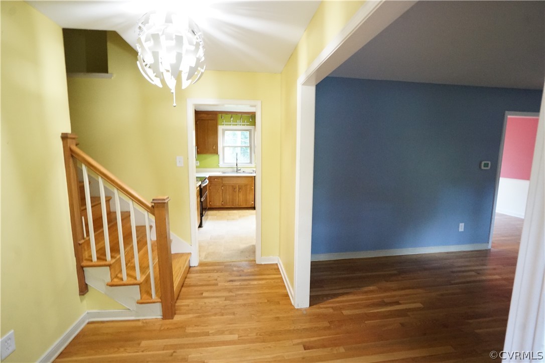 10110 Oldham Road Richmond, VA 23235 - Photo 8 of 26 a view of a hallway with wooden floor and staircase