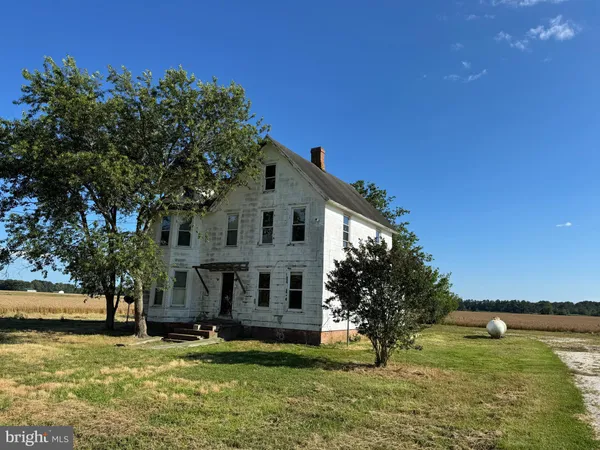 a view of a house with a yard porch and sitting area