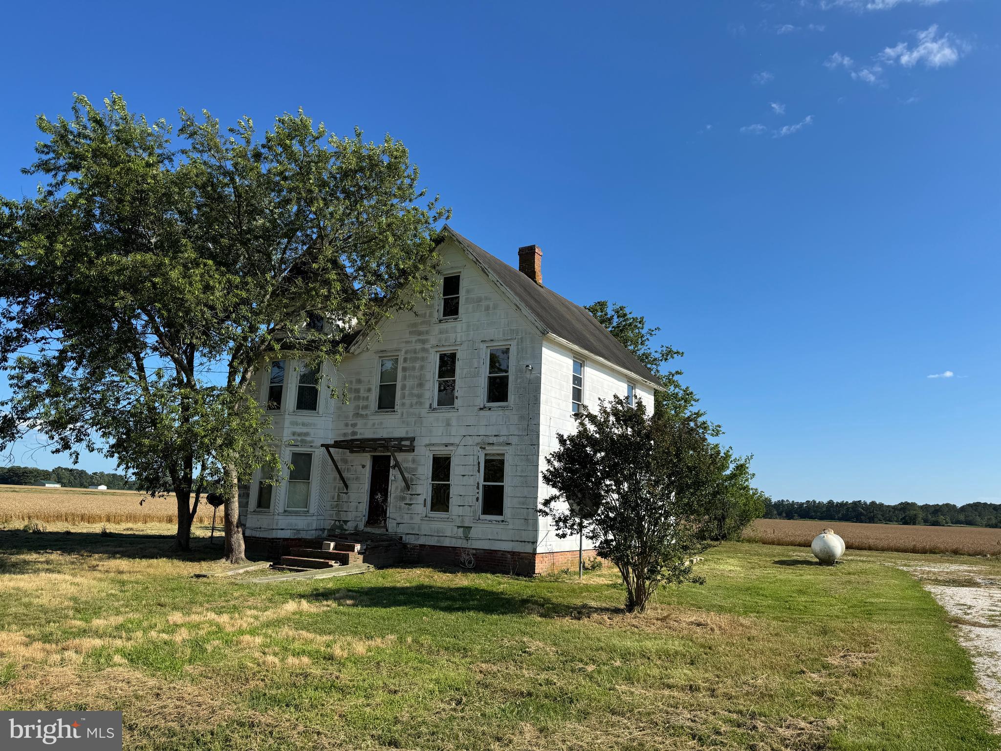 a view of a house with a yard porch and sitting area