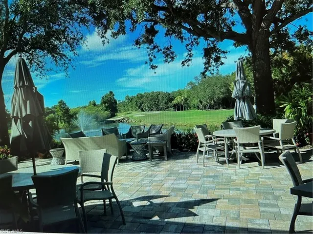a view of a chairs and table in patio