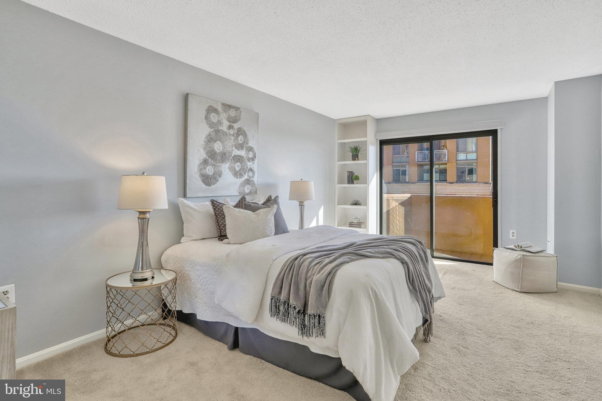 1301 North Courthouse Road, Unit 1610 Arlington, VA 22201 - Photo 16 of 41 a spacious bedroom with a bed and window