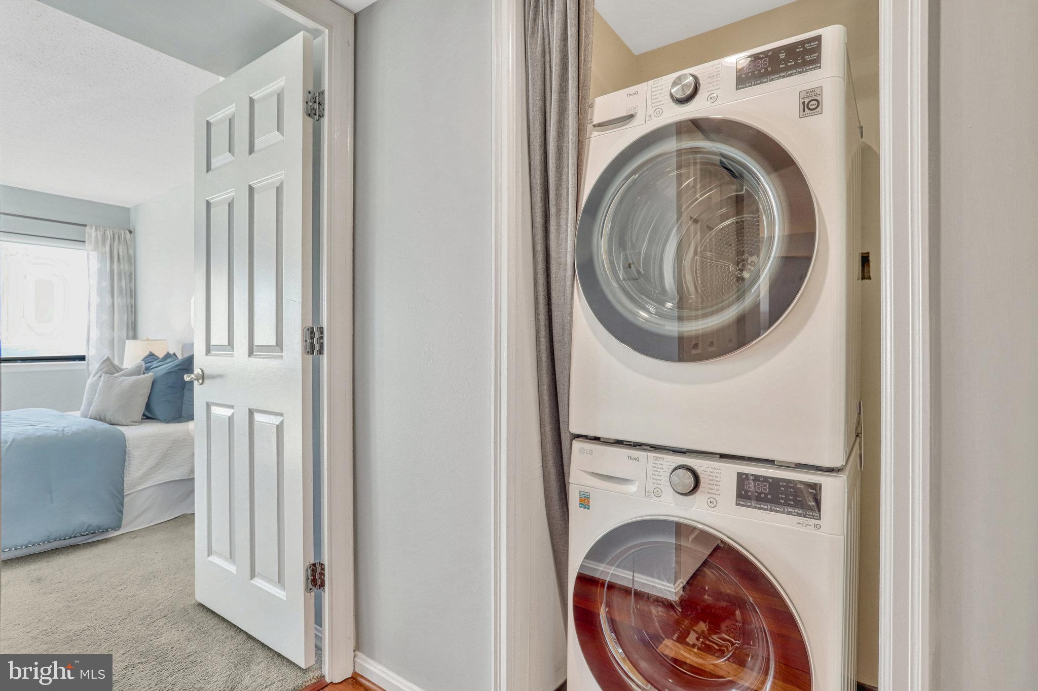1301 North Courthouse Road, Unit 1610 Arlington, VA 22201 - Photo 23 of 41 a view of a hallway with washer and dryer