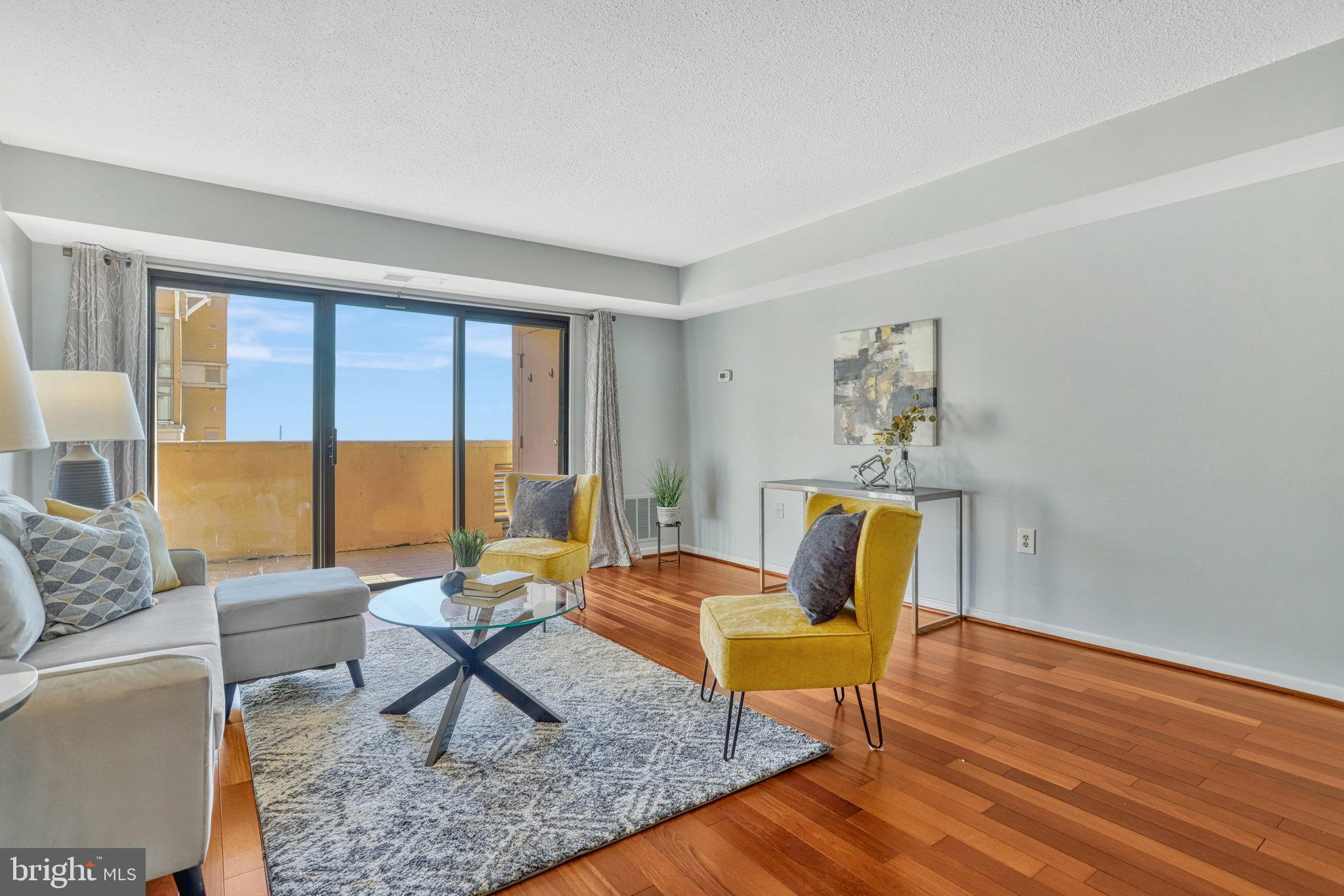 1301 North Courthouse Road, Unit 1610 Arlington, VA 22201 - Photo 5 of 41 a living room with furniture and a window
