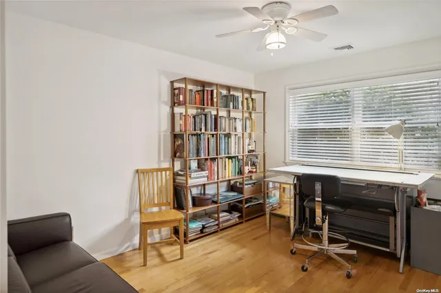 a view of a livingroom with furniture and a window