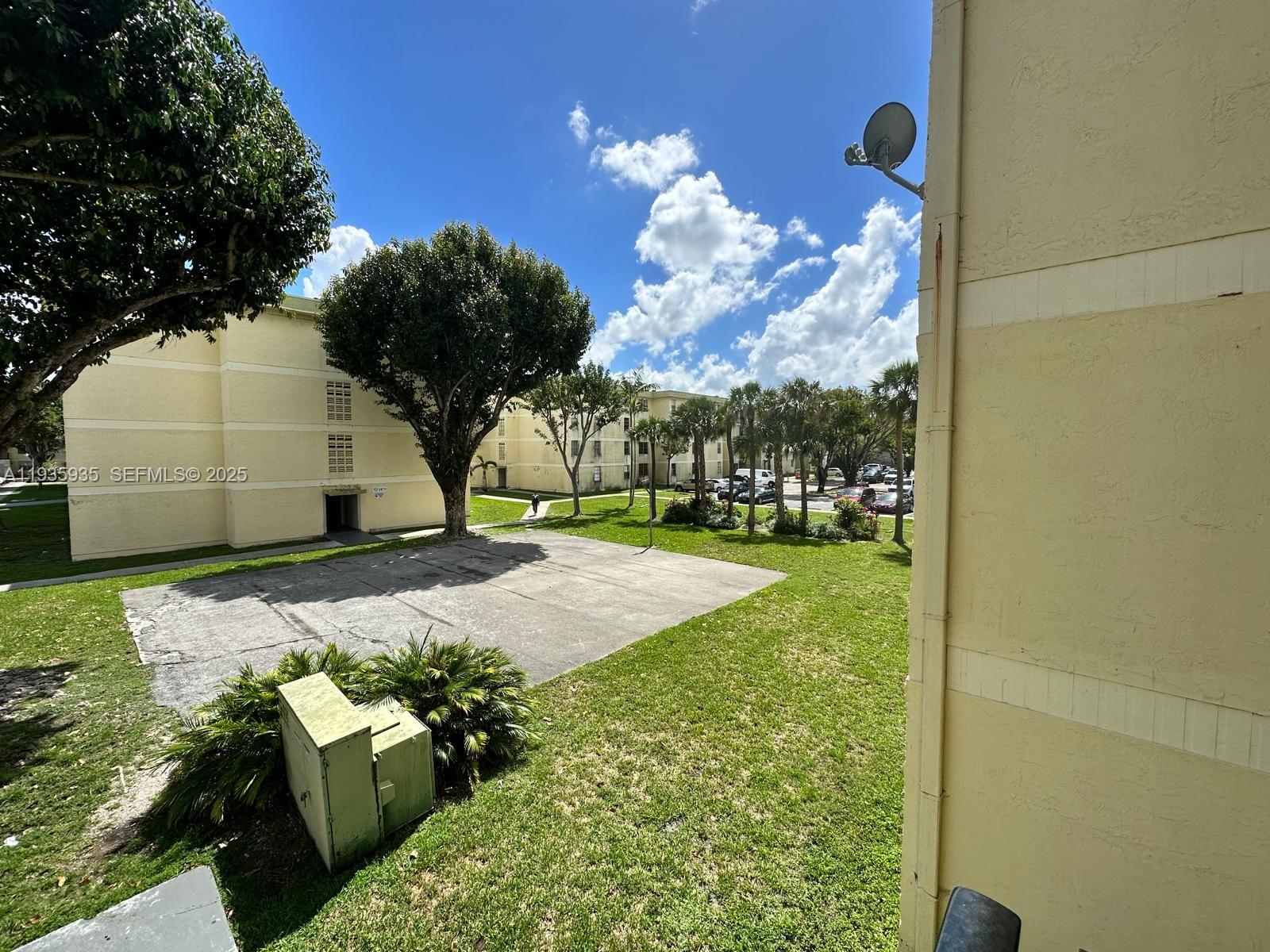 1875 West 56th Street, Unit 301 Hialeah, FL 33012 - Photo 2 of 17 a view of a garden