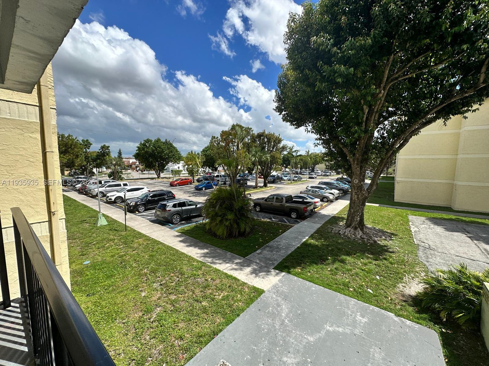 1875 West 56th Street, Unit 301 Hialeah, FL 33012 - Photo 3 of 17 a view of swimming pool from a balcony