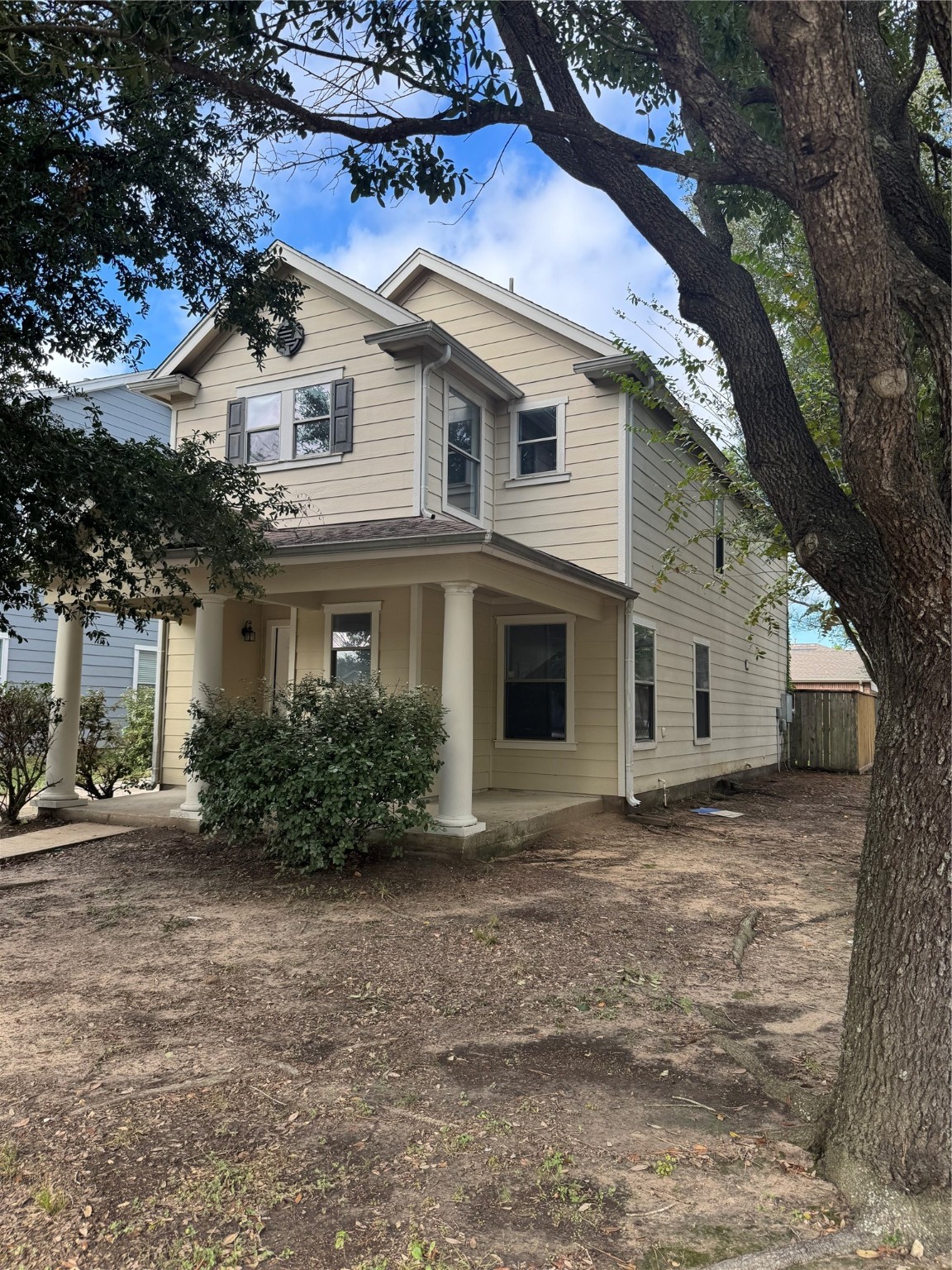 8111 Liberty Point Lane Humble, TX 77338 - Photo 2 of 14 a view of a white house with a large tree