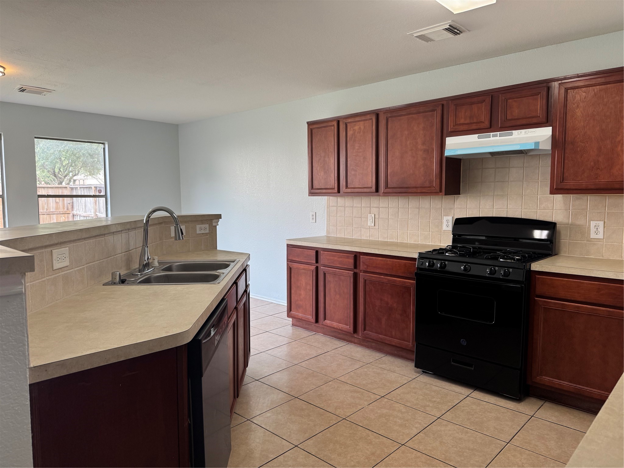 8111 Liberty Point Lane Humble, TX 77338 - Photo 4 of 14 a kitchen with a sink and a stove top oven