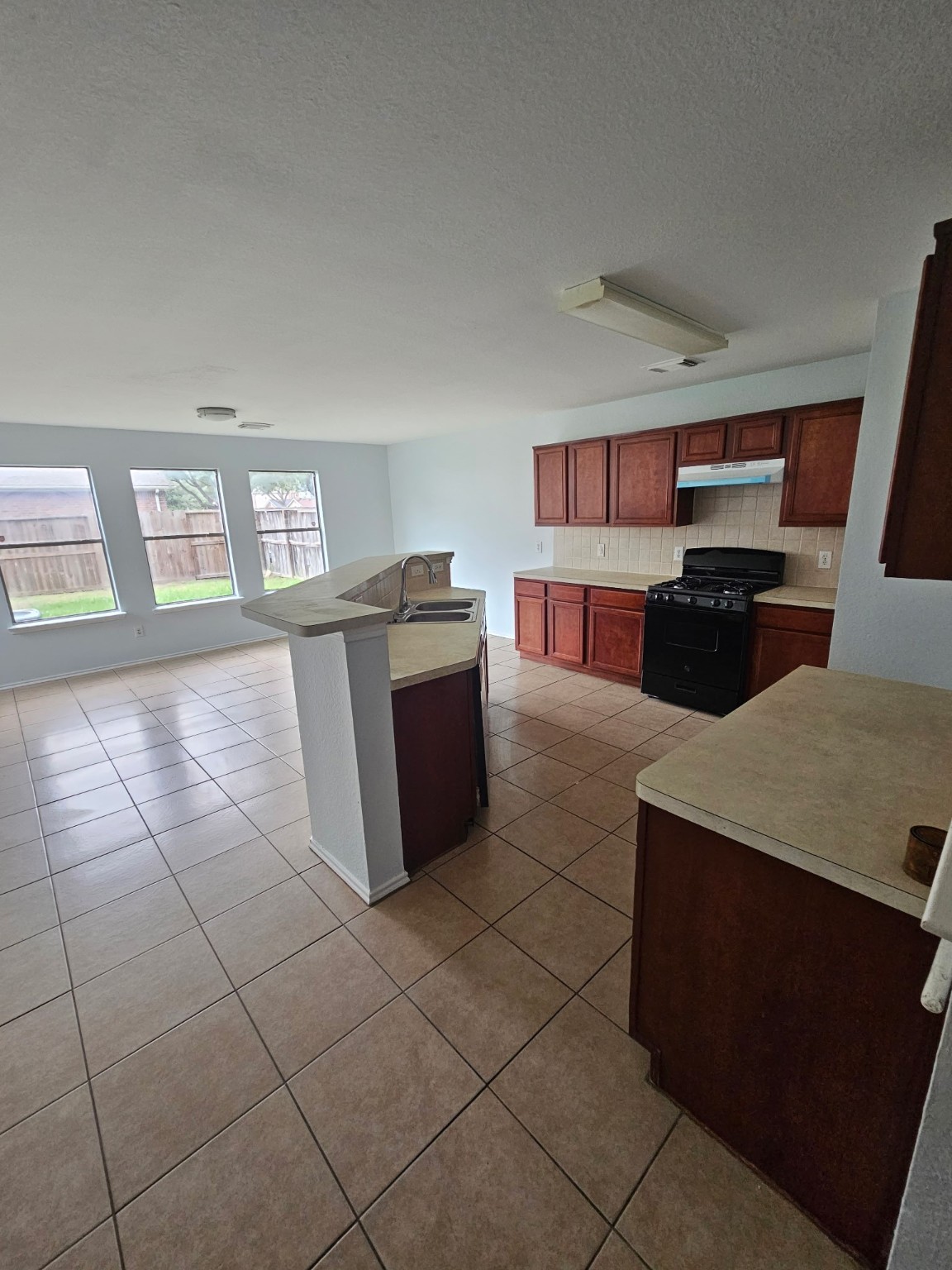 8111 Liberty Point Lane Humble, TX 77338 - Photo 10 of 14 a kitchen with stainless steel appliances granite countertop a stove a sink and a refrigerator