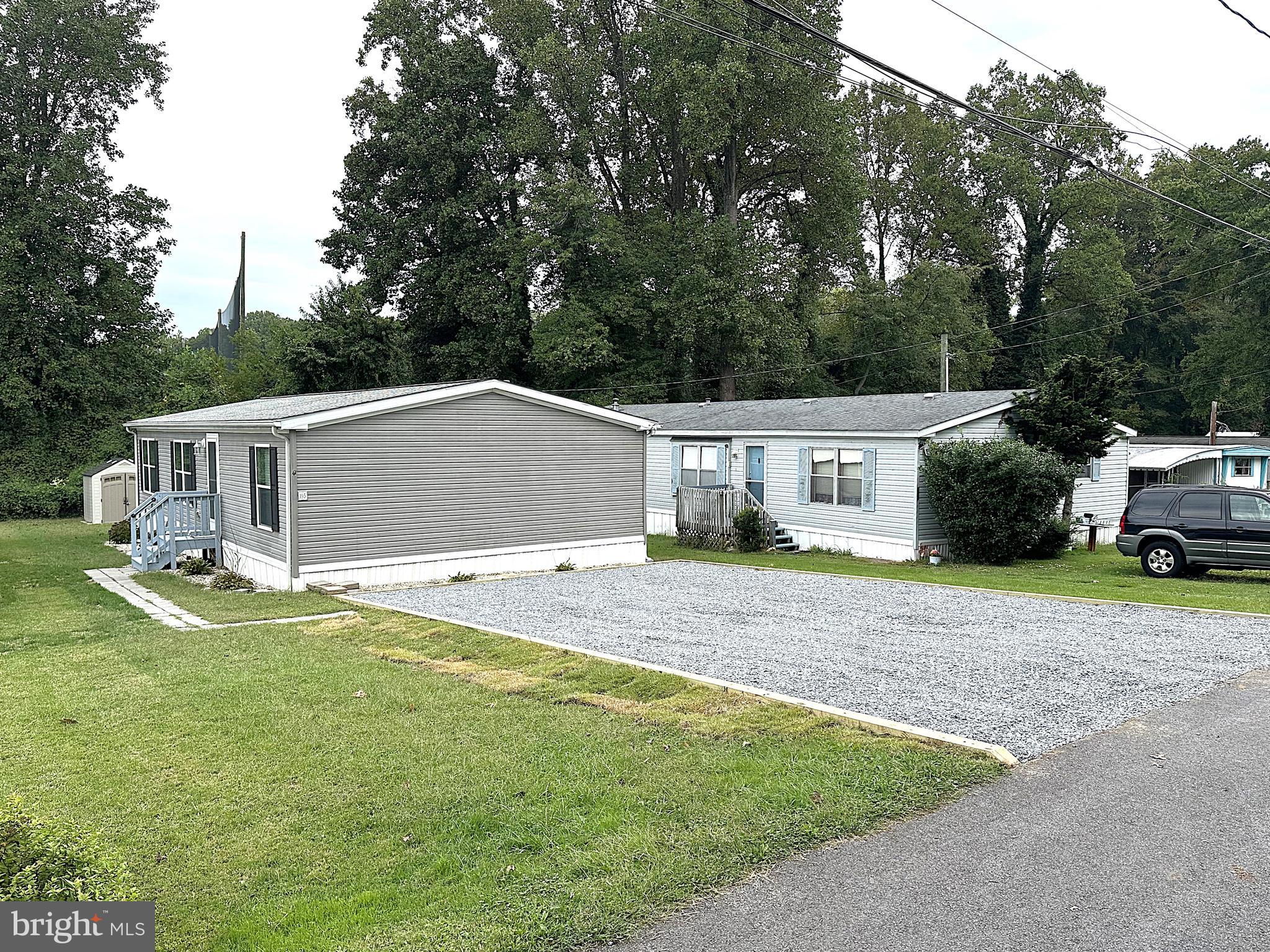 1277 Ritchie Highway, Unit 195 Arnold, MD 21012 - Photo 30 of 30 a front view of a house with a yard and garage