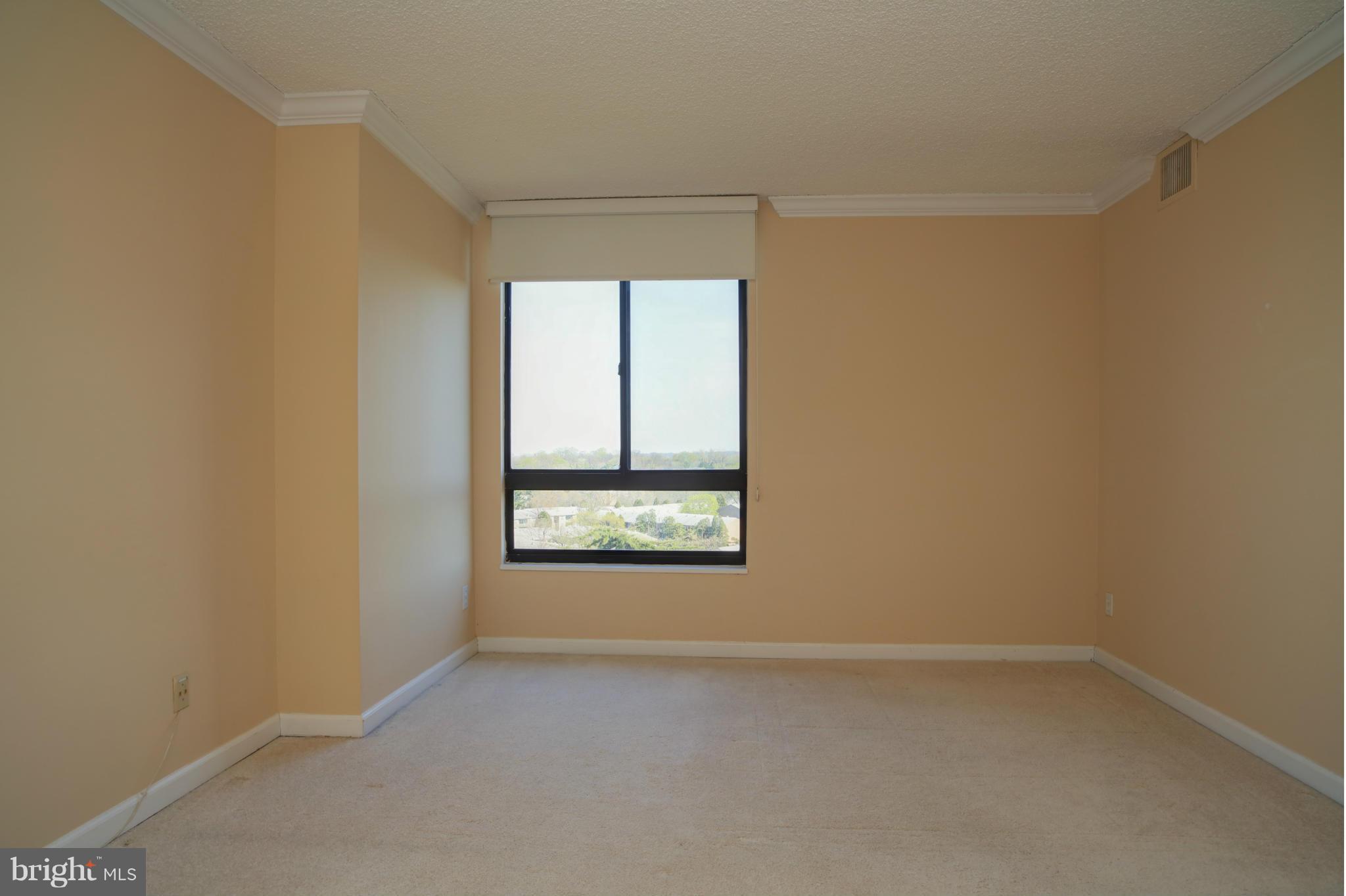 1800 Old Meadow Road, Unit 713 McLean, VA 22102 - Photo 14 of 27 a view of an empty room with a window