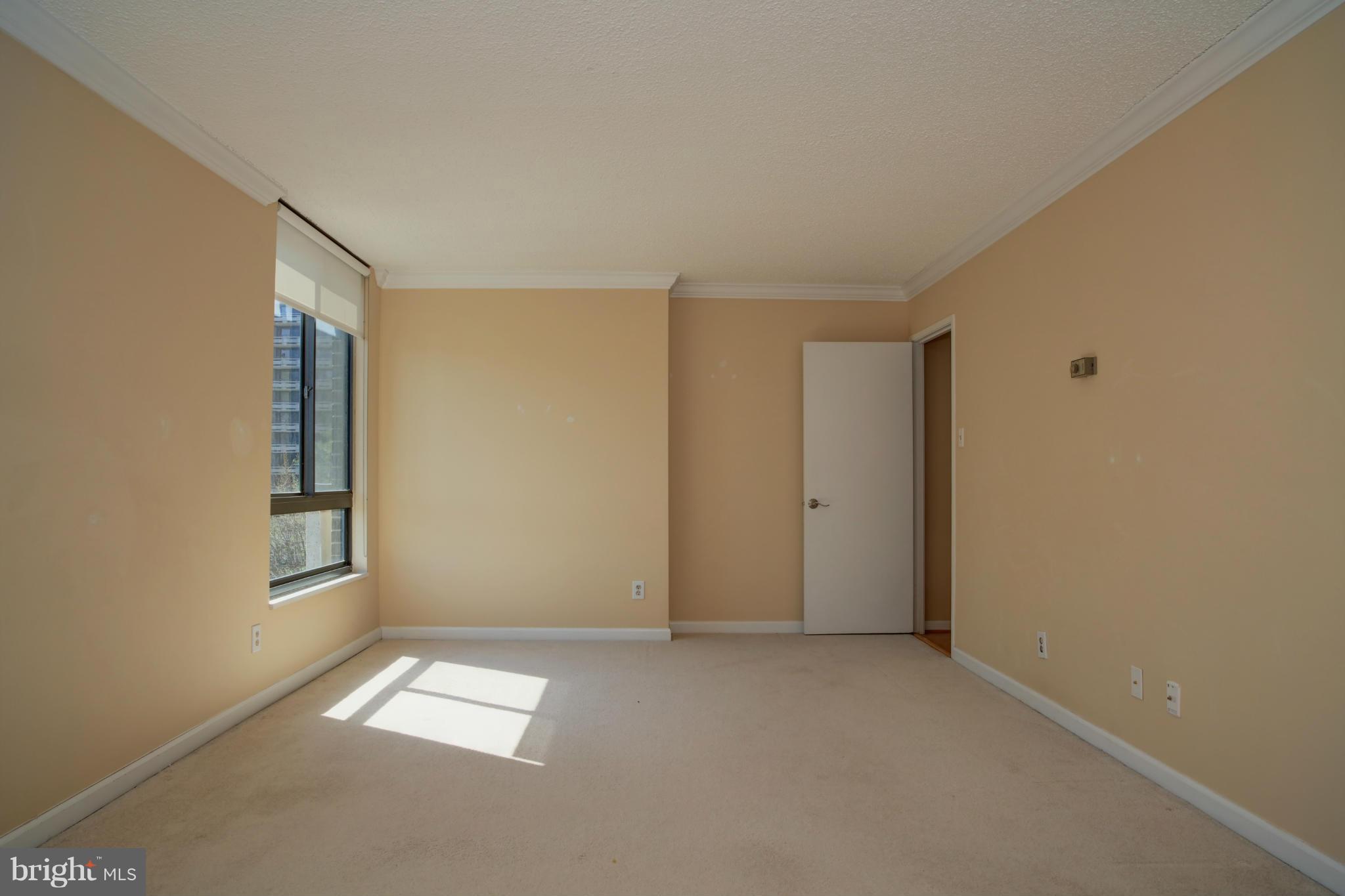 1800 Old Meadow Road, Unit 713 McLean, VA 22102 - Photo 18 of 27 an empty room with windows