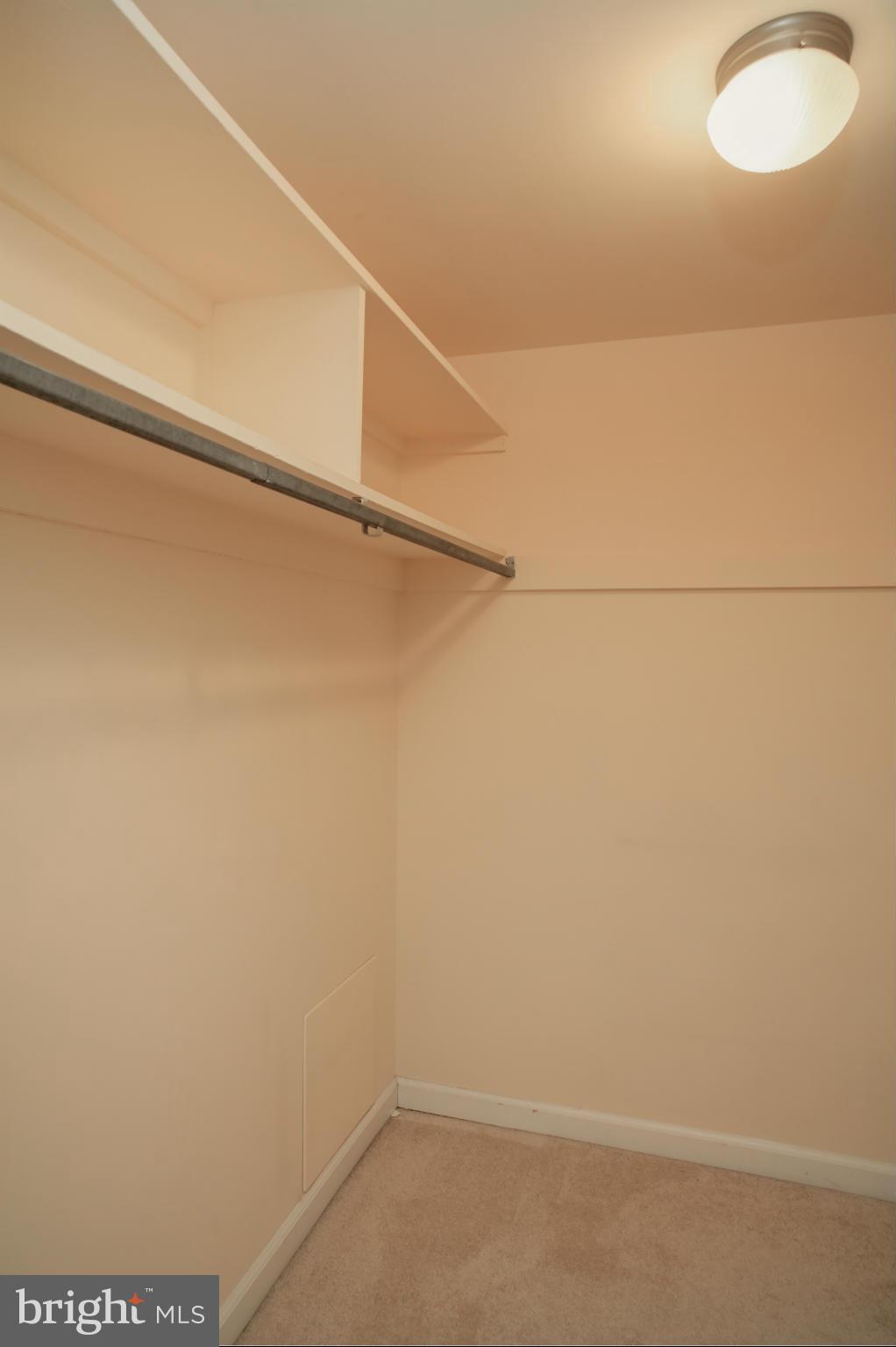 1800 Old Meadow Road, Unit 713 McLean, VA 22102 - Photo 19 of 27 a view of a room with racks on the wall