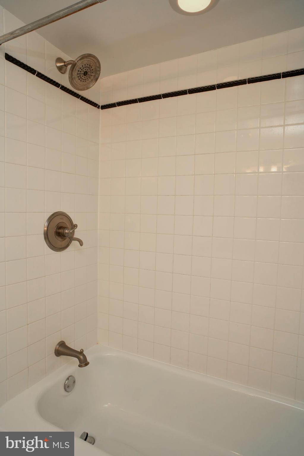 1800 Old Meadow Road, Unit 713 McLean, VA 22102 - Photo 21 of 27 a bathroom with a shower