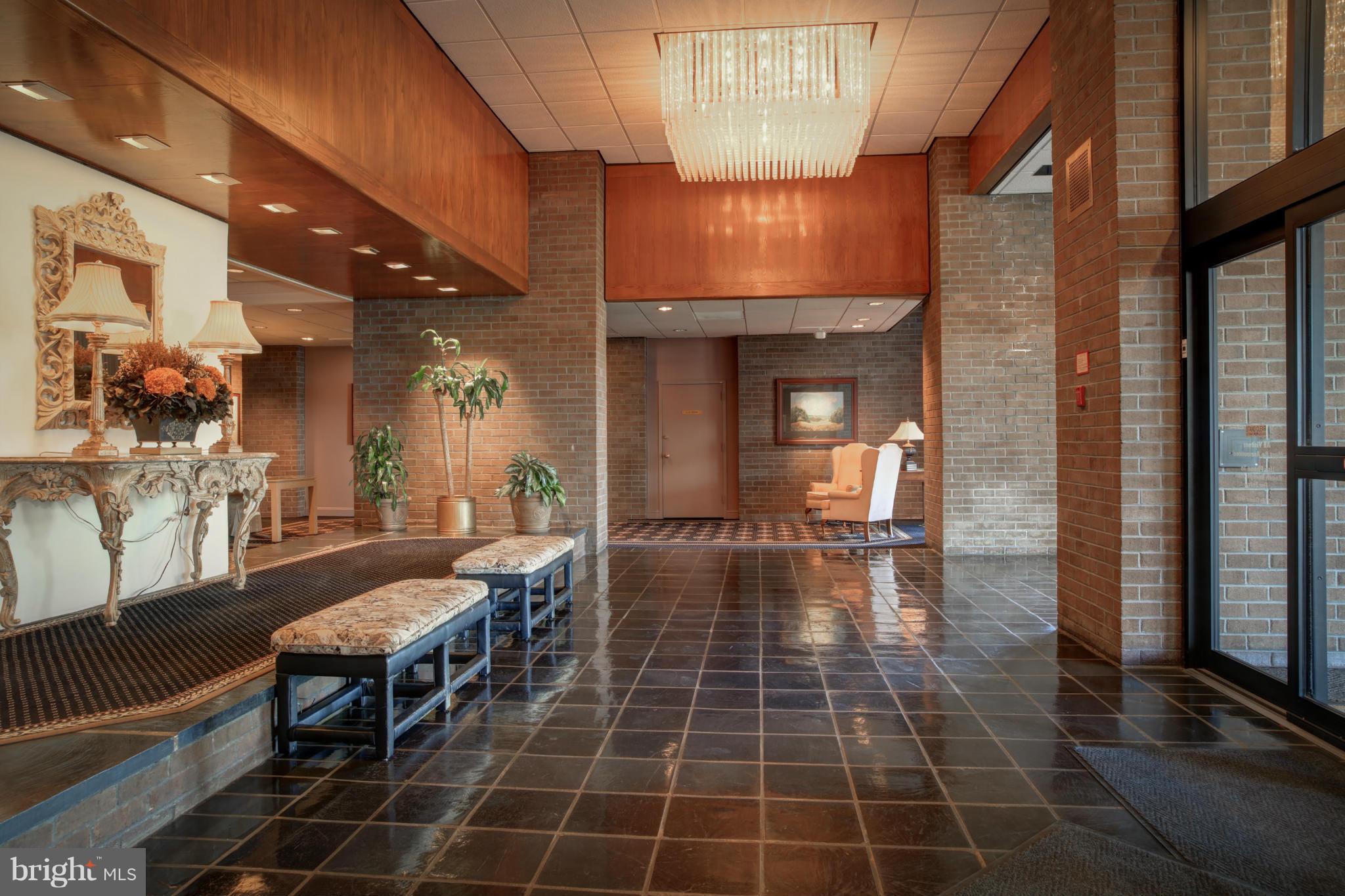1800 Old Meadow Road, Unit 713 McLean, VA 22102 - Photo 26 of 27 a lobby with furniture and rug