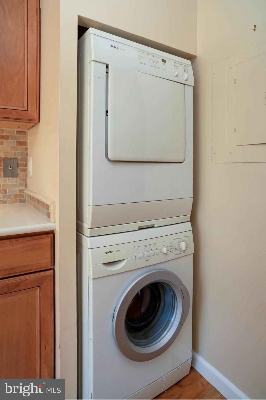 1800 Old Meadow Road, Unit 713 McLean, VA 22102 - Photo 6 of 27 a utility room with dryer and washer