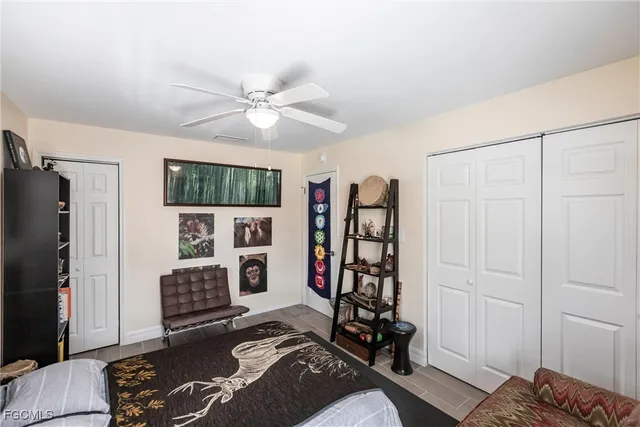 a view of a livingroom with furniture and staircase