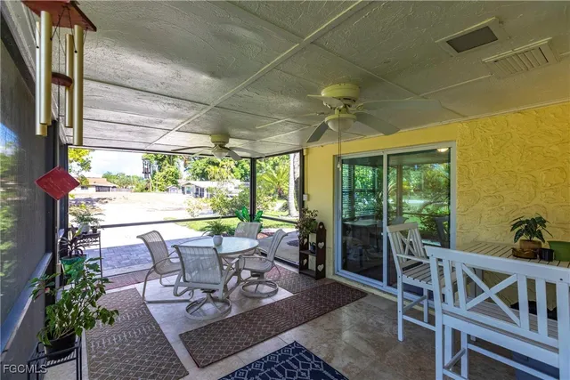 a view of a patio with a dining table and chairs