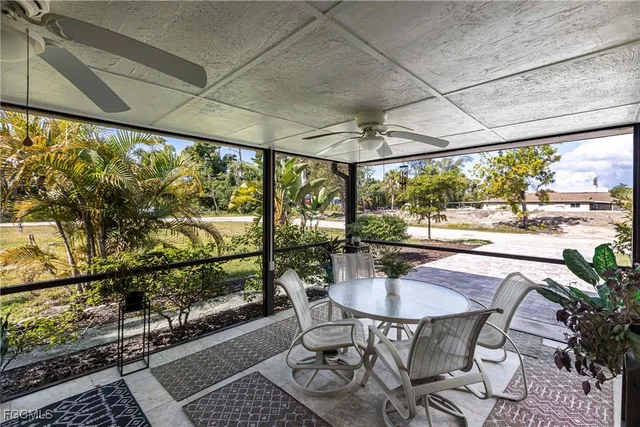 a dining room with furniture wooden floor and a potted plant