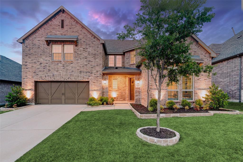 14230 Shiloh Springs Drive Frisco, TX 75035 - Photo 1 of 1 a front view of a house with a yard fire pit and a fountain