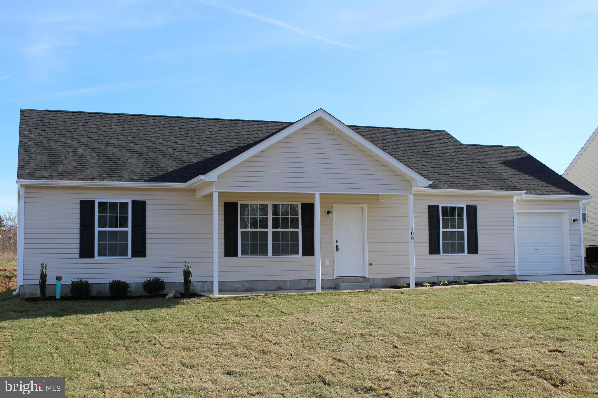 186 Job Road Inwood, WV 25428 - Photo 1 of 11 a house with yard in front of it