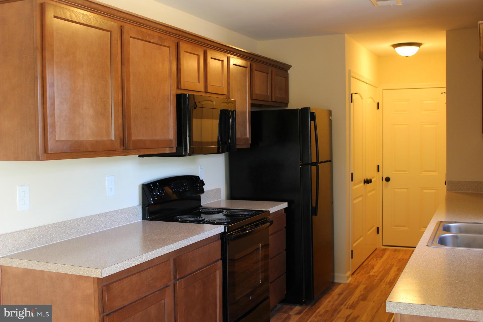 186 Job Road Inwood, WV 25428 - Photo 4 of 11 a kitchen with a refrigerator and a sink