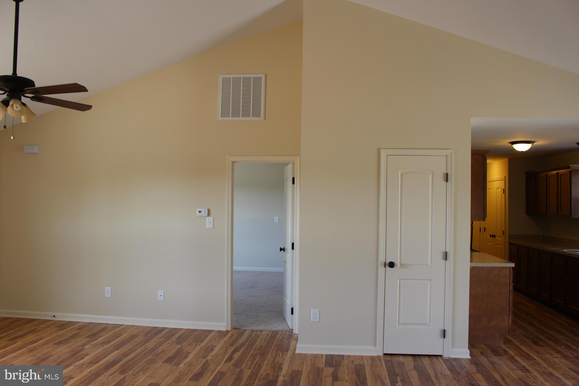 186 Job Road Inwood, WV 25428 - Photo 8 of 11 a view of a hallway with wooden floor and closet area