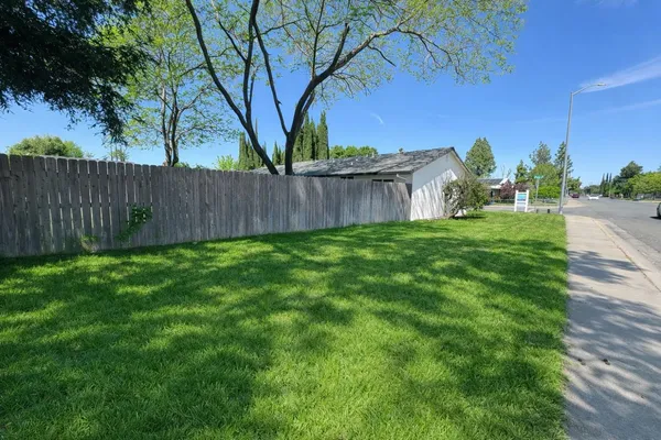 a backyard of a house with lots of green space