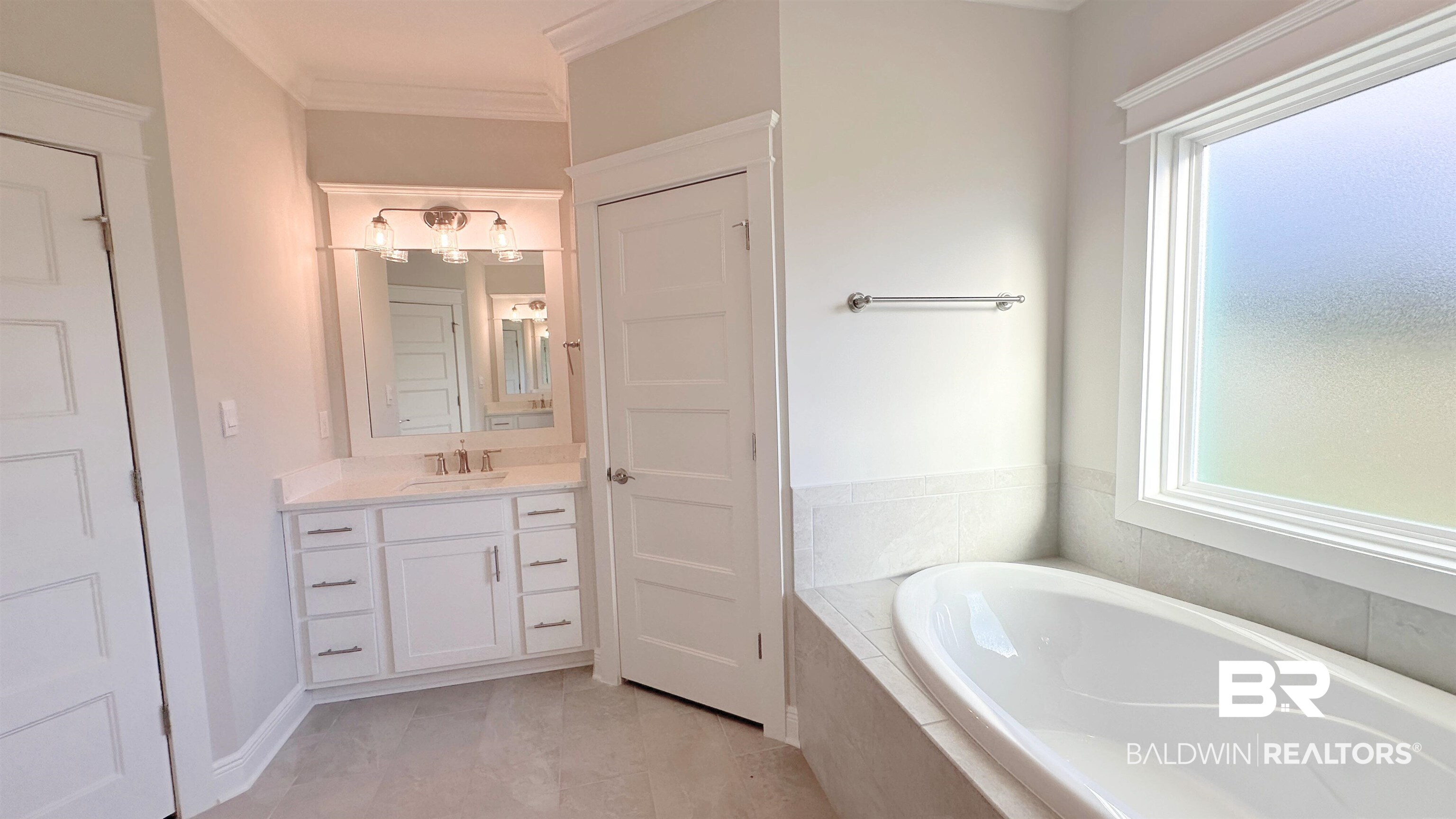 126 Daybreak Trail Fairhope, AL 36532 - Photo 14 of 34 Bathroom with a bath, plenty of natural light, vanity, and ornamental molding