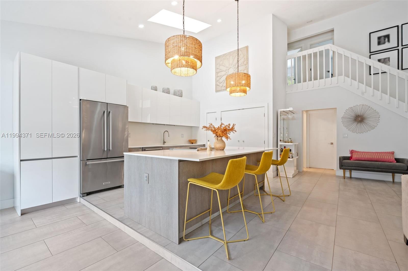 11758 Southwest 92nd Terrace Miami, FL 33186 - Photo 12 of 30 a kitchen with a refrigerator and a table