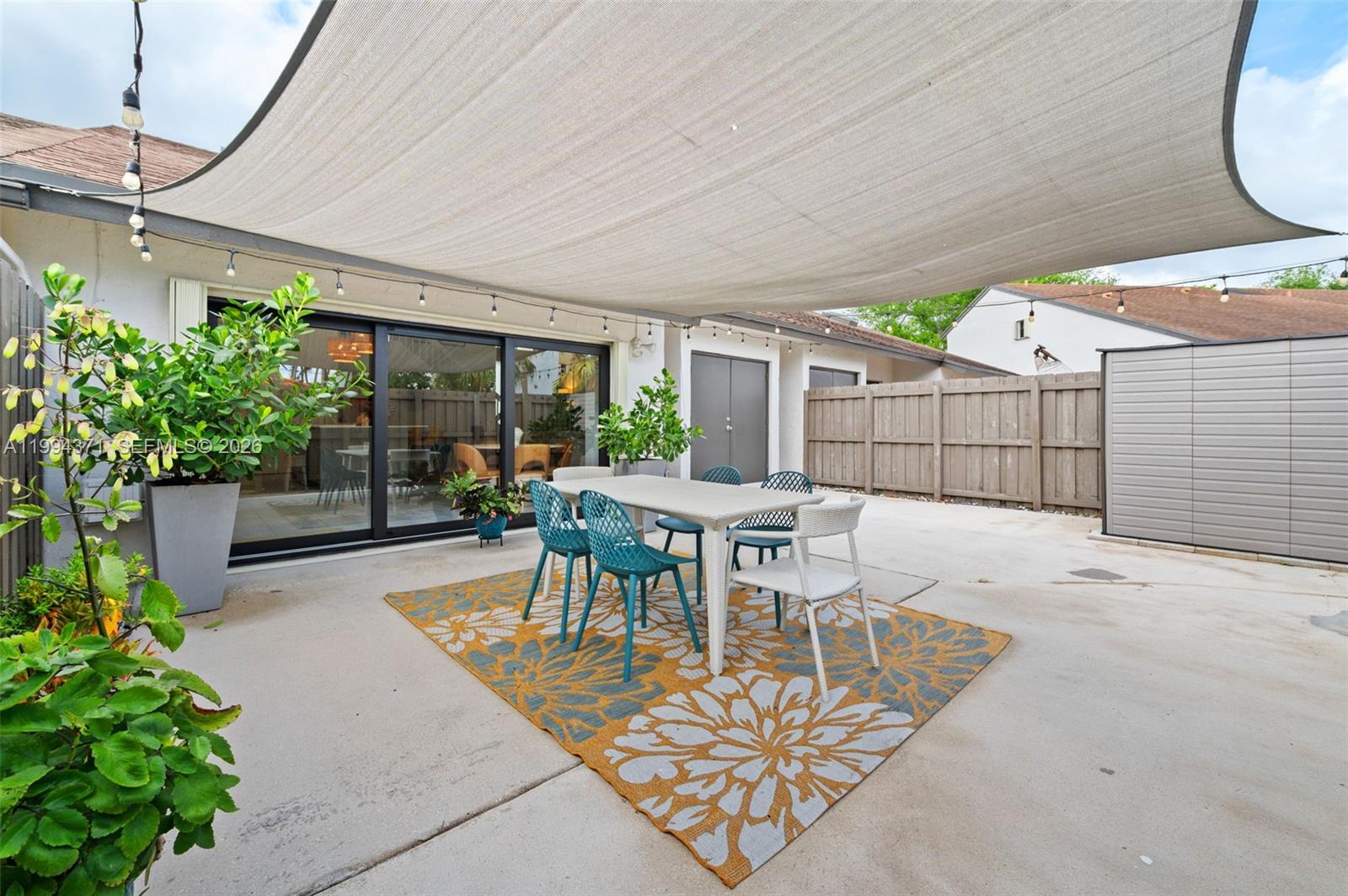 11758 Southwest 92nd Terrace Miami, FL 33186 - Photo 21 of 30 a view of a patio with a table and chairs