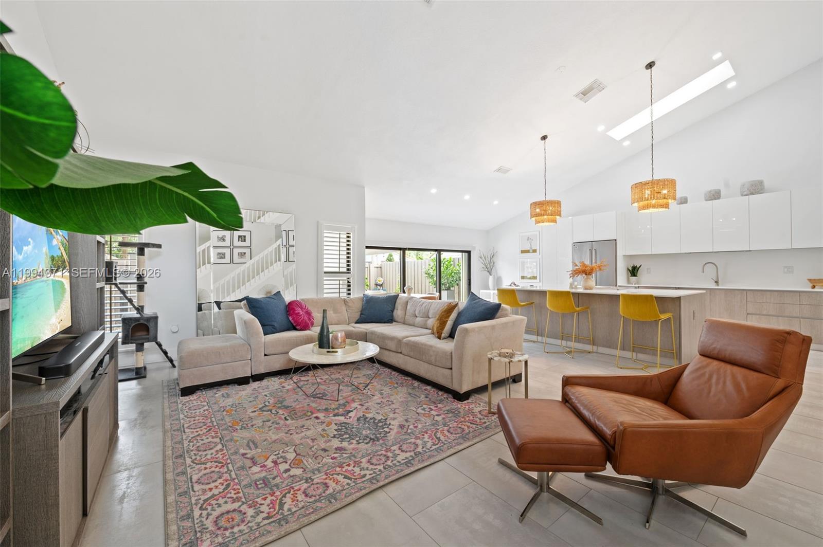 11758 Southwest 92nd Terrace Miami, FL 33186 - Photo 5 of 30 a living room with furniture and a large window