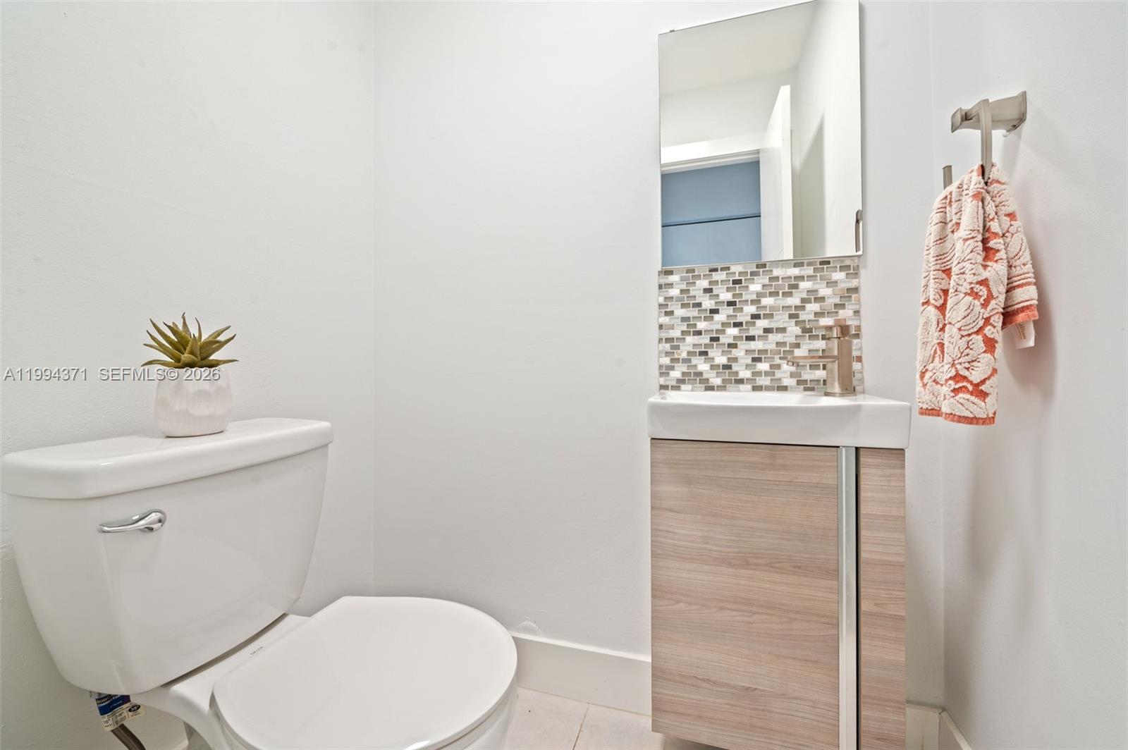 11758 Southwest 92nd Terrace Miami, FL 33186 - Photo 7 of 30 a bathroom with a toilet and a sink
