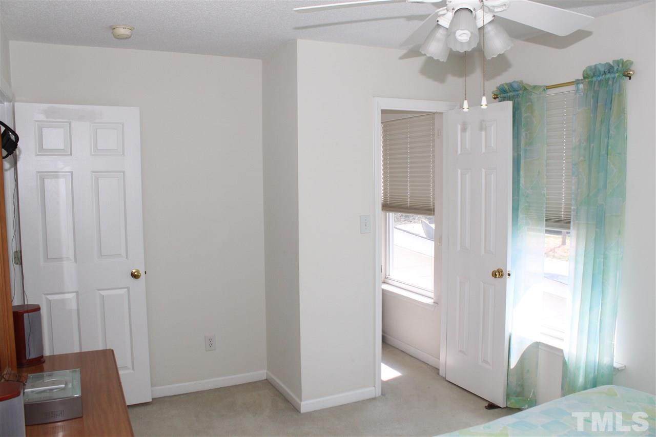 4001 Hopper Street Raleigh, NC 27616 - Photo 22 of 25 a living room with furniture and a chandelier