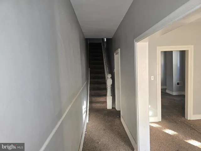 a bathroom with a granite countertop sink