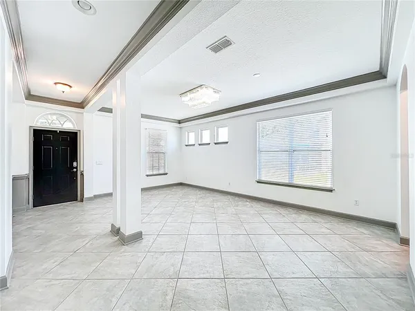 a kitchen with stainless steel appliances granite countertop a stove top oven a refrigerator a sink and dishwasher with wooden cabinets