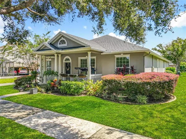 a front view of house with yard and green space