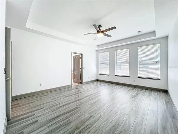 a bathroom with a shower sink and mirror