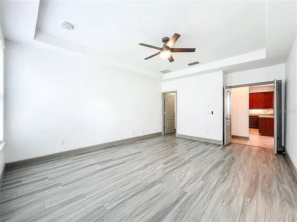 a large bathroom with a granite countertop tub sink and glass door shower