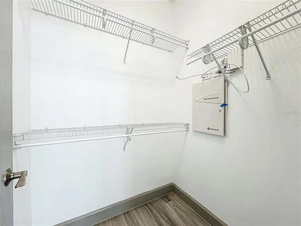 a bathroom with a granite countertop sink a toilet and a large mirror
