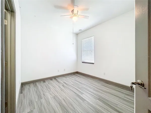 a front view of a house with a garden and yard