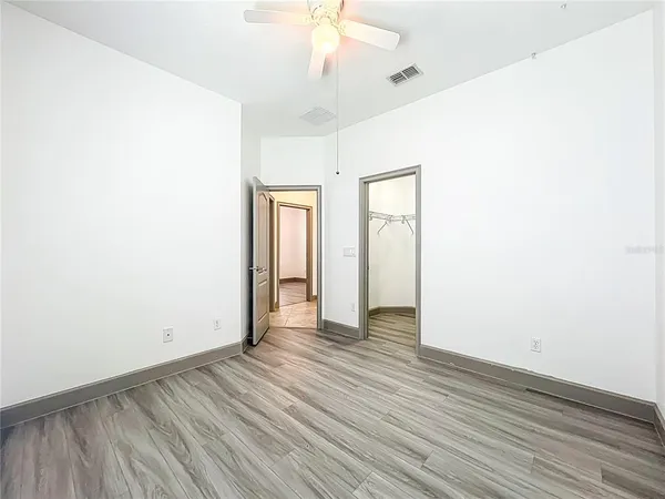 a front view of a house with a garden and plants