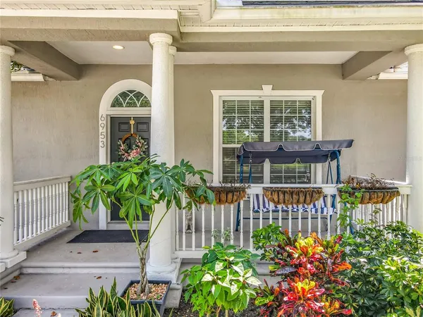 a view of a hallway with wooden cabinets