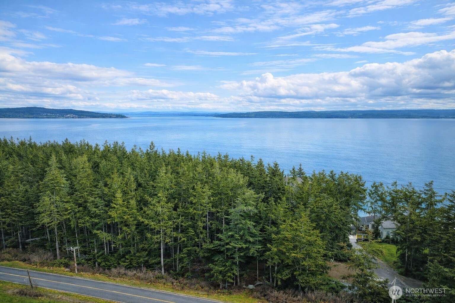 1012 North Scenic Heights Road Oak Harbor, WA 98277 - Photo 2 of 25 a view of a lake with a yard