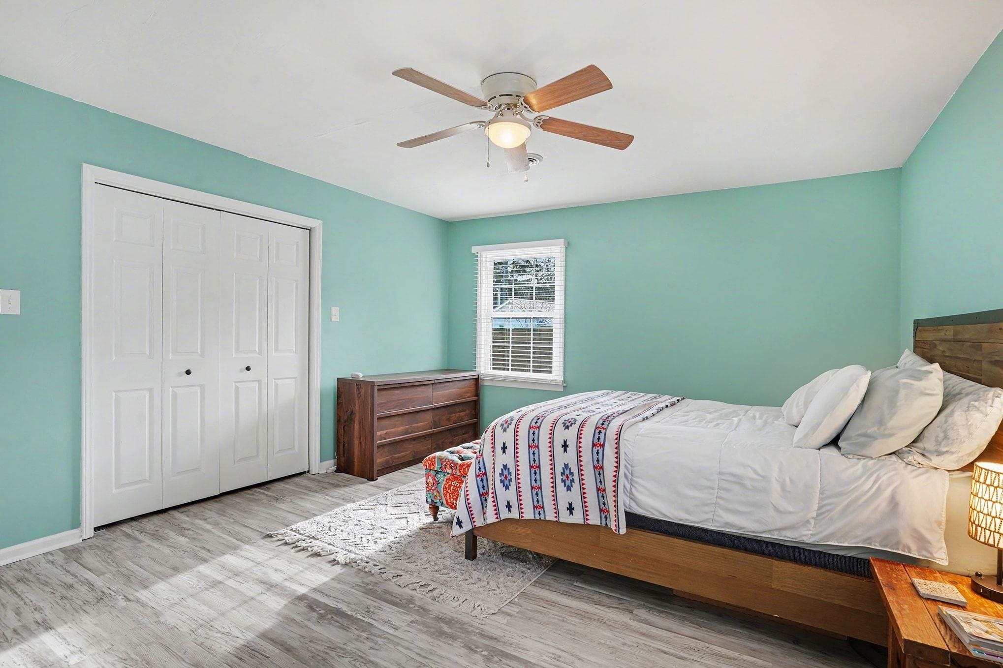 317 Jay Street Murrells Inlet, SC 29576 - Photo 18 of 36 Bedroom featuring wood finished floors, a closet, and a ceiling fan