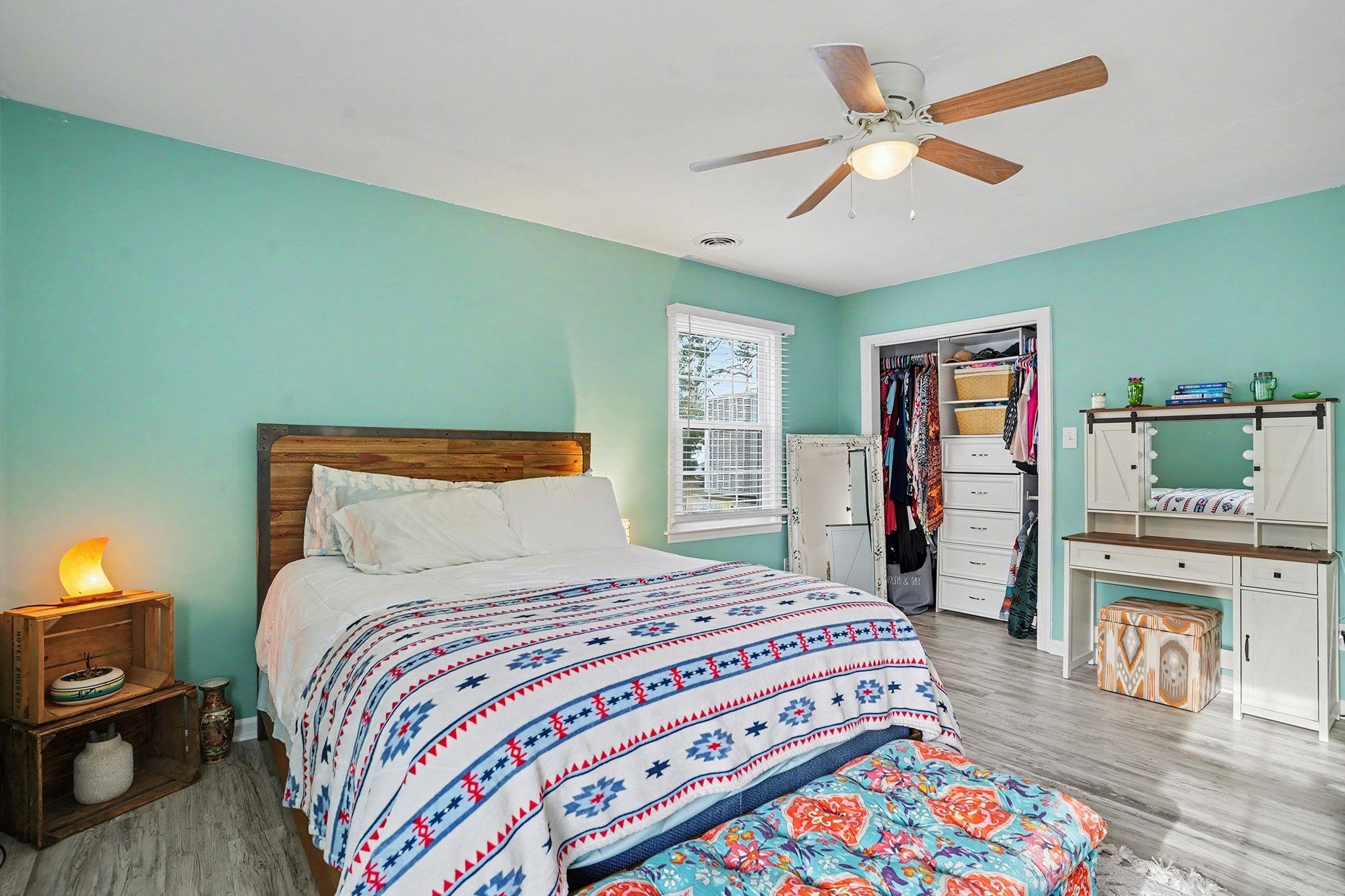 317 Jay Street Murrells Inlet, SC 29576 - Photo 19 of 36 Bedroom featuring wood finished floors, a ceiling fan, and a walk in closet