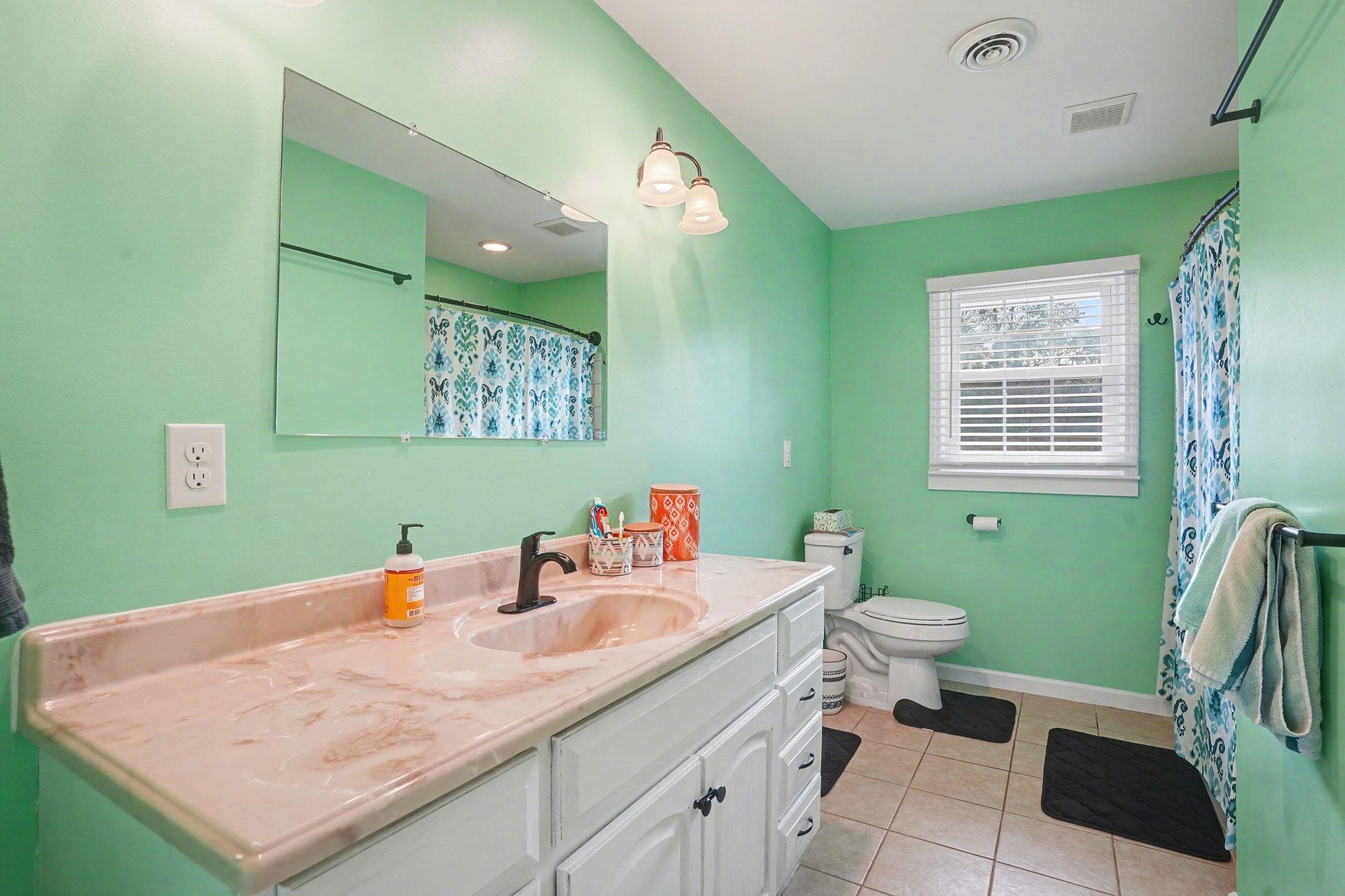 317 Jay Street Murrells Inlet, SC 29576 - Photo 20 of 36 Full bathroom featuring vanity, a shower with shower curtain, and light tile patterned floors