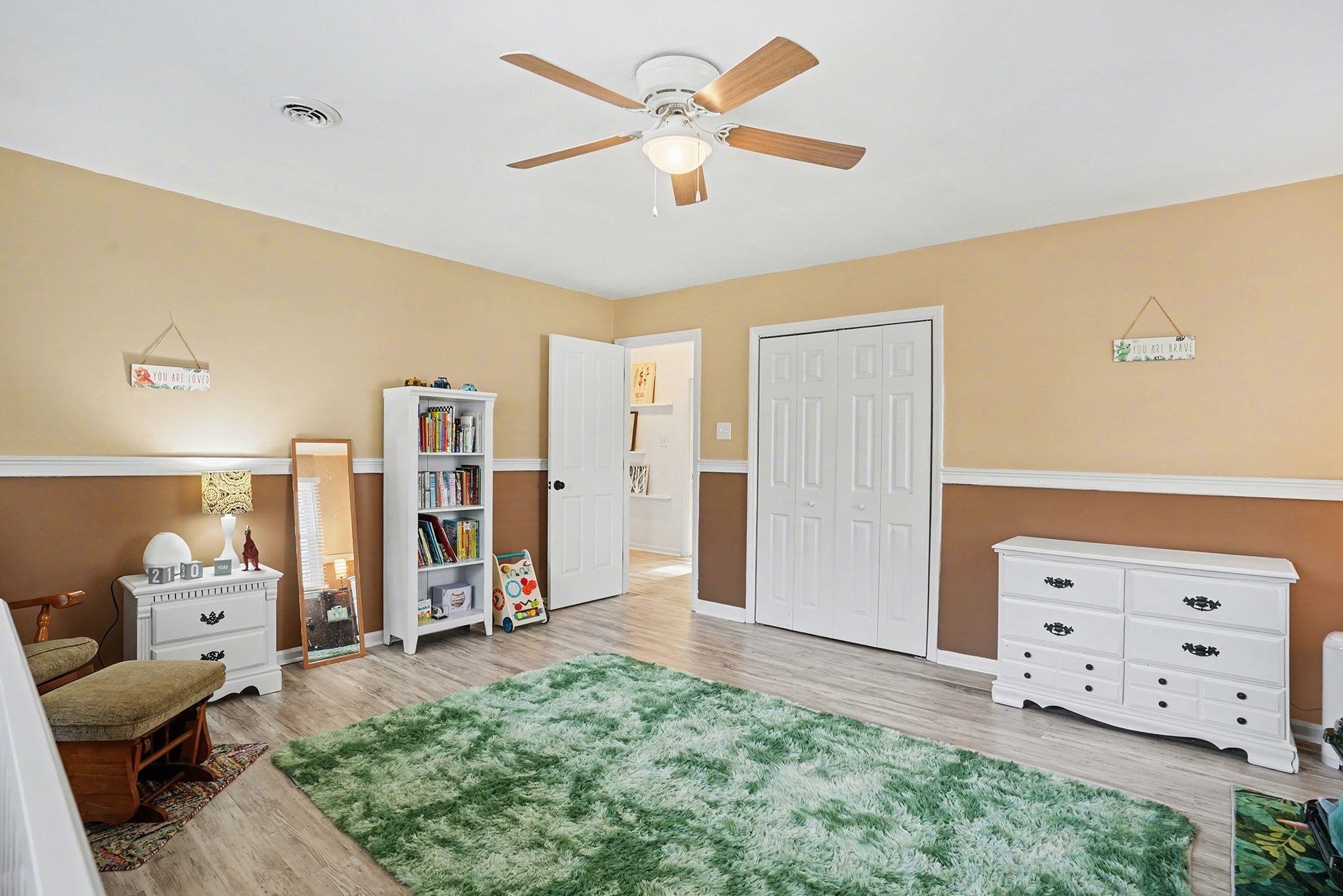 317 Jay Street Murrells Inlet, SC 29576 - Photo 23 of 36 Bedroom featuring ceiling fan, light wood-style floors, and a closet