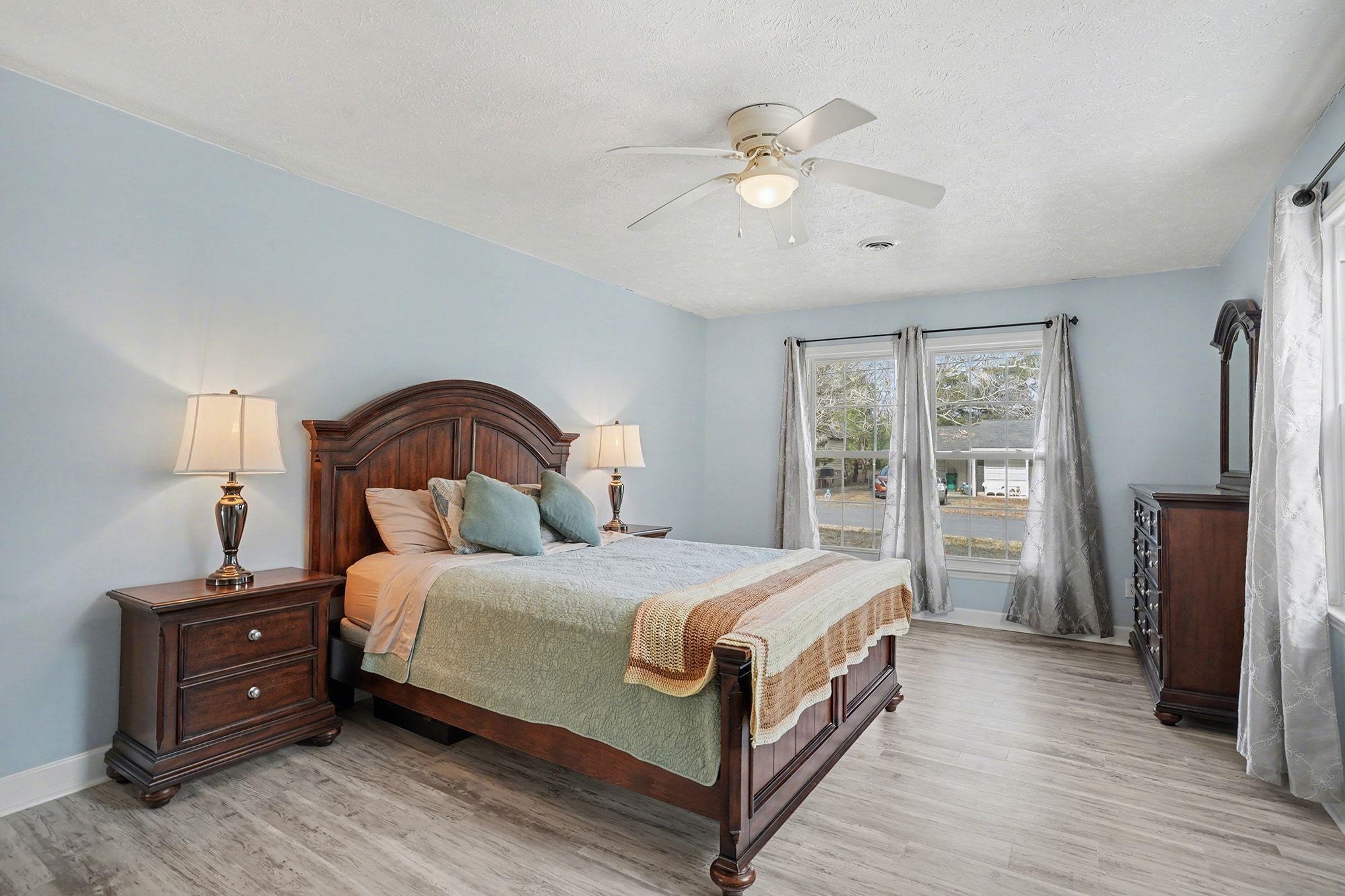 317 Jay Street Murrells Inlet, SC 29576 - Photo 26 of 36 Bedroom featuring a ceiling fan, light wood-type flooring, and a textured ceiling